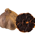 Schwarzer Knoblauch, ganze und aufgeschnittene Knolle